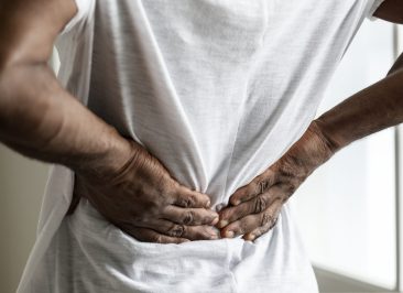 Black man suffering back pain