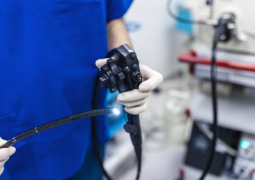 Endoscopy at the hospital. Doctor holding endoscope before gastroscopy. Medical examination