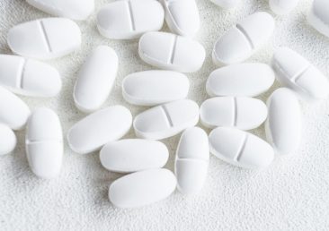 overhead-view-white-pills-rough-background