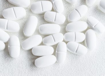 overhead-view-white-pills-rough-background